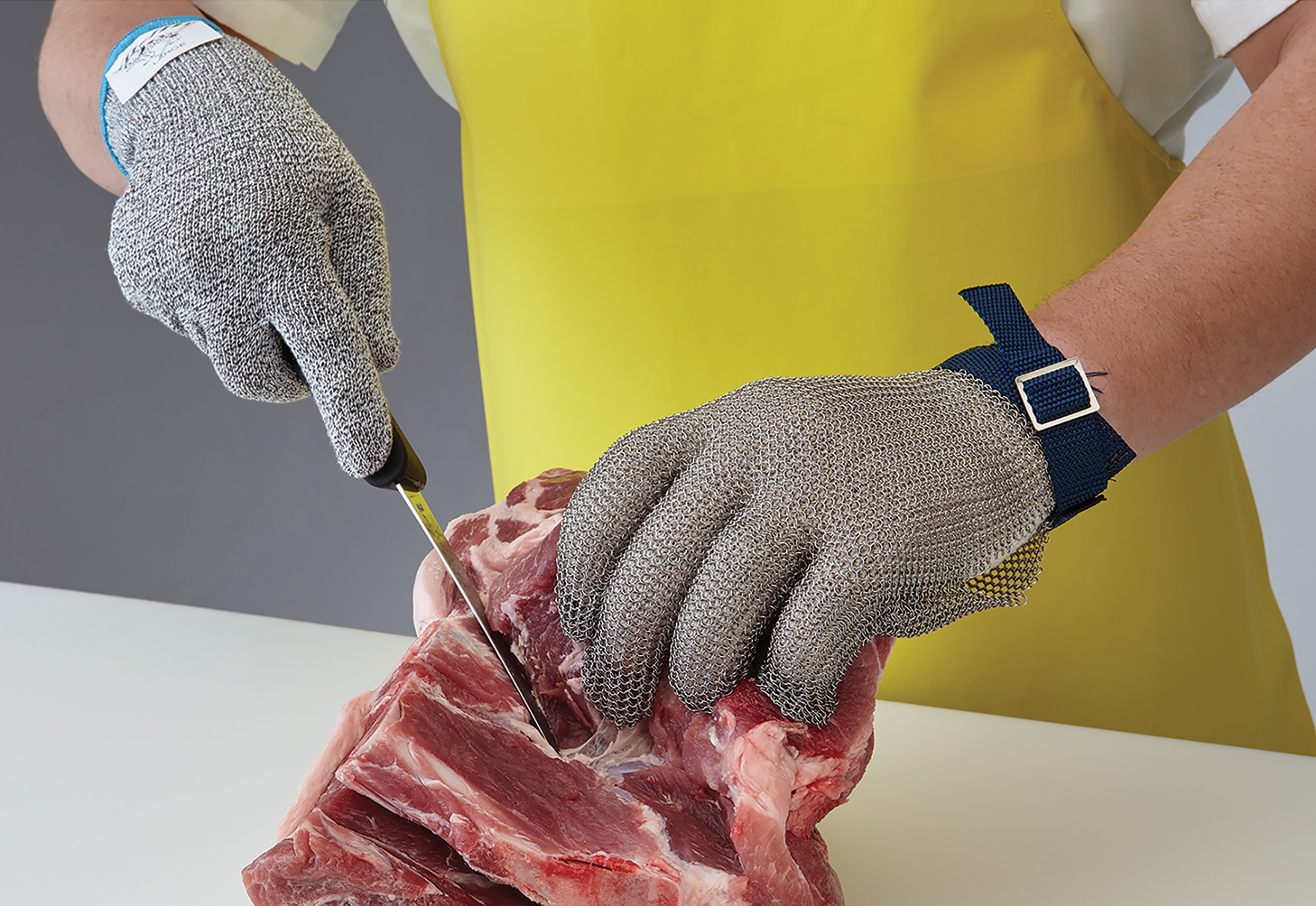 Cut-resistant and metal mesh gloves used during meat processing